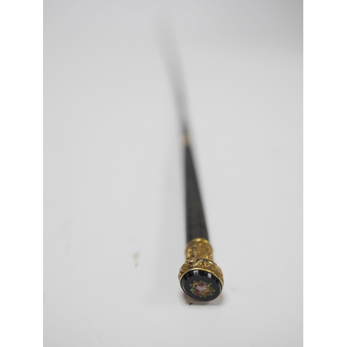 1448 - A gilt mounted whip with micro mosaic floral terminal, 78cm long. Condition - whip worn from use, te... 