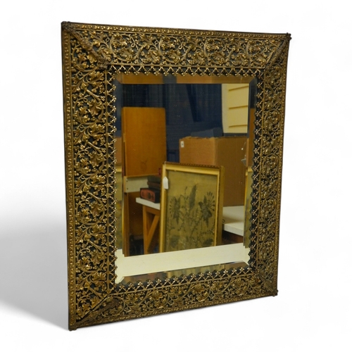 1450 - A period-style embossed metal easel mirror, 41cm x 50cm. Condition - easel stand missing now convert... 