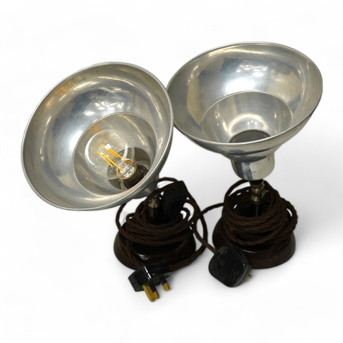 1451 - A pair of industrial-style photography aluminium shaded spot-lights on Bakelite stands, 29cm high. C... 