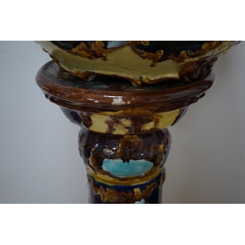 1454 - A Edwardian pottery jardiniere and stand, 104cm. Condition - fair to good