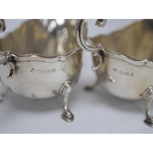 1850 - A matched pair of George V silver sauceboats, Horace Woodward & Co Ltd, Birmingham, 1921 and Adie Br... 