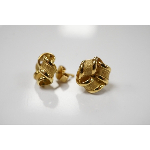 1902 - A pair of 18ct yellow gold stud earrings of knotted design with a textured finish, 1.1cm diameter ea... 