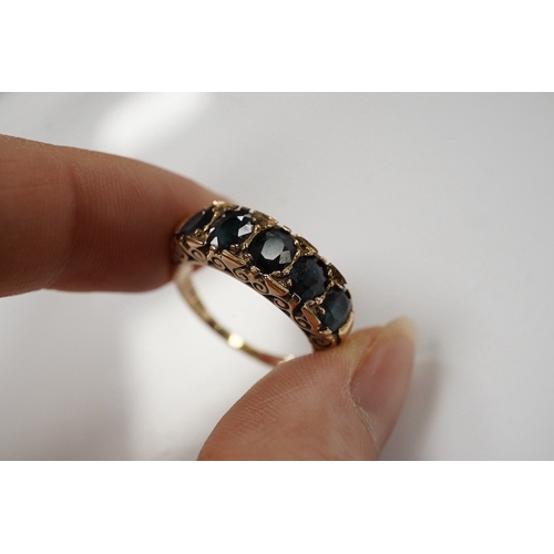 1909 - A 1970's Victorian style 9ct gold and graduated five stone sapphire set half hoop ring, size Q, gros... 