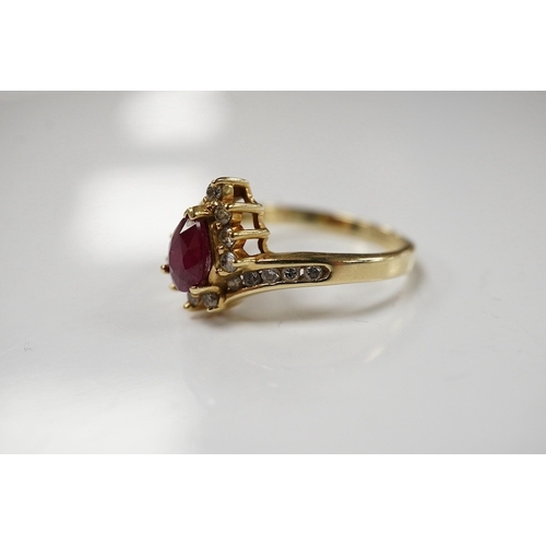 1912 - A recent 14k, ruby and diamond cluster set dress ring, size O,  gross weight 3.4 grams. Condition - ... 