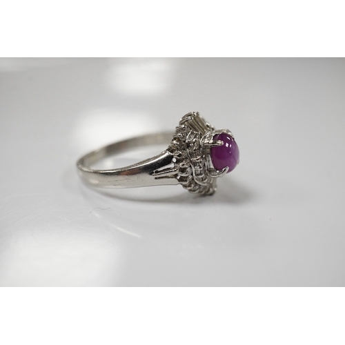 1918 - A modern platinum, star ruby and diamond cluster set dress ring, size J/K, gross weight 4.7 grams. C... 