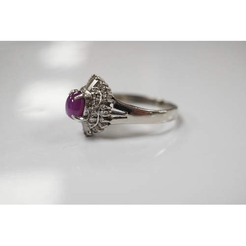 1918 - A modern platinum, star ruby and diamond cluster set dress ring, size J/K, gross weight 4.7 grams. C... 