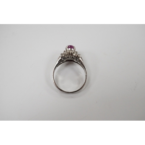 1918 - A modern platinum, star ruby and diamond cluster set dress ring, size J/K, gross weight 4.7 grams. C... 