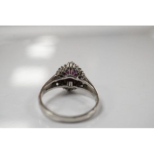 1918 - A modern platinum, star ruby and diamond cluster set dress ring, size J/K, gross weight 4.7 grams. C... 