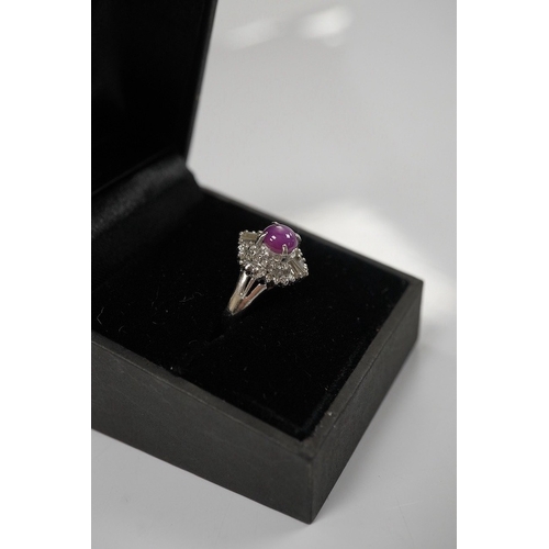 1918 - A modern platinum, star ruby and diamond cluster set dress ring, size J/K, gross weight 4.7 grams. C... 