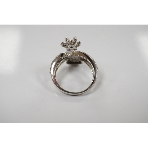 1919 - A modern 18ct white gold and diamond cluster set split shank double flower head ring, size K, gross ... 