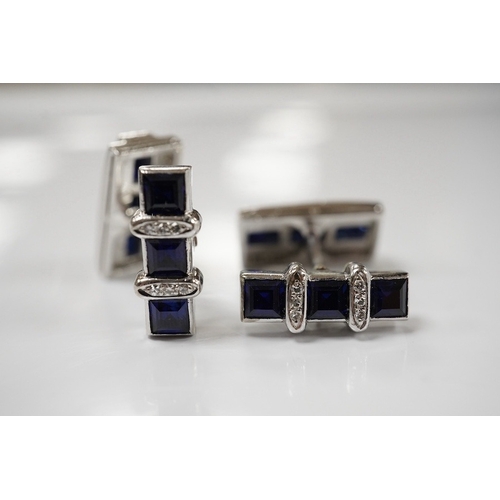 1922 - A pair of white metal, synthetic sapphire and diamond three row line cuff links, of curved rectangul... 