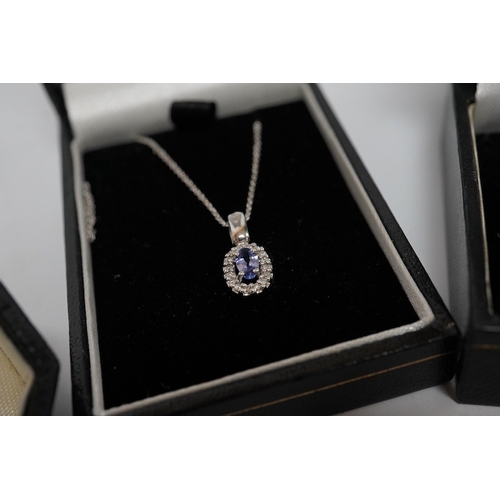 1924 - A modern 750 white metal, diamond and gem set oval cluster pendant, 8mm, on an 18ct white gold fine ... 