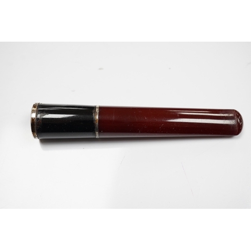 1927 - Three assorted cased cigarette holders, including amber, largest 10.1cm. Condition - fair