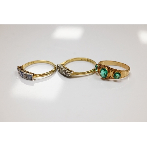 1935 - A group of three rings and a gold toothpick comprising: a five-stone French-cut synthetic sapphire a... 