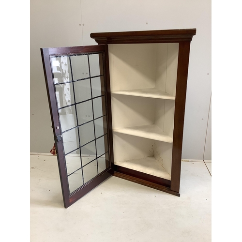 100 - A George III style glazed mahogany hanging corner cabinet, with leaded glazing bars, width 77cm, dep... 