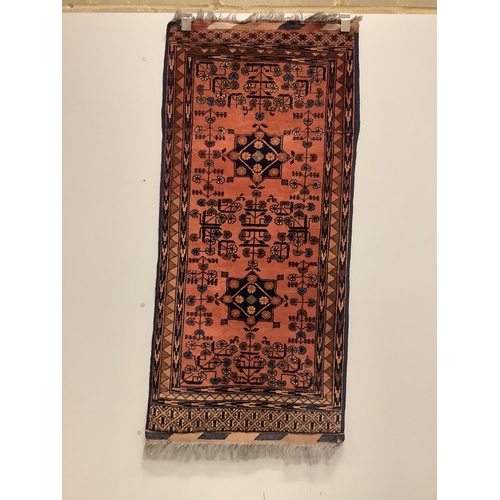 16 - A Belouch red ground rug and a Bokhara rug, larger 180 x 106cm. Condition - fair