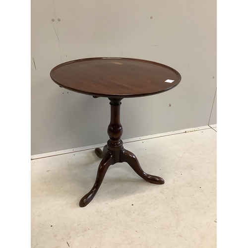 20 - A George III circular mahogany tilt top tripod tea table, diameter 63cm, height 69cm. Condition - fa... 