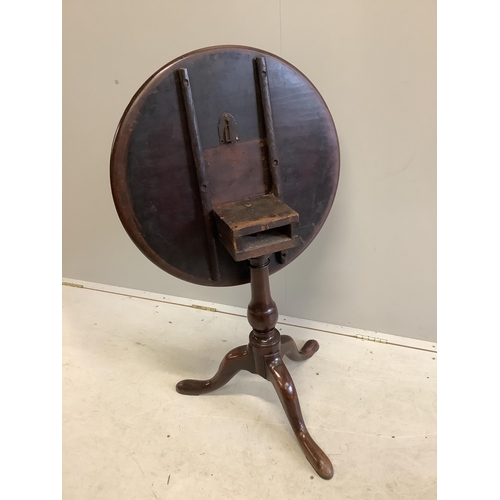 20 - A George III circular mahogany tilt top tripod tea table, diameter 63cm, height 69cm. Condition - fa... 