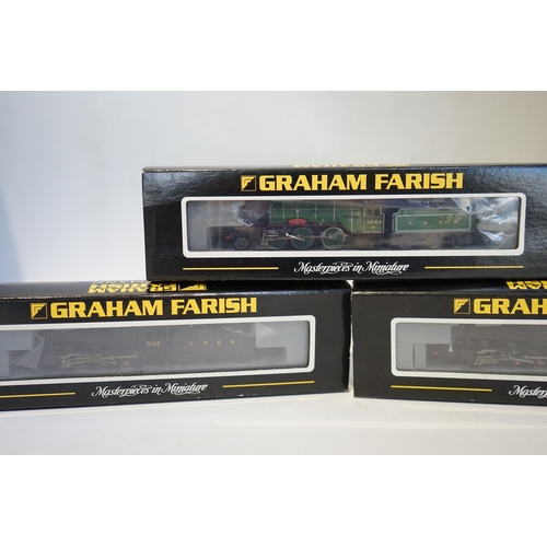 283 - Three boxed Graham Farish N gauge railway LNER tender locomotives; a Class 8F, 3107 (372-150), a Cla... 