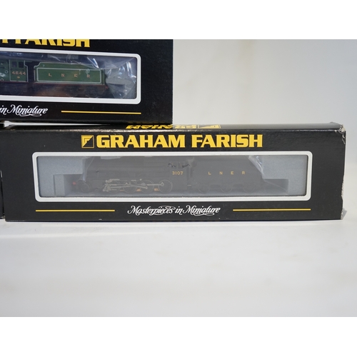 283 - Three boxed Graham Farish N gauge railway LNER tender locomotives; a Class 8F, 3107 (372-150), a Cla... 