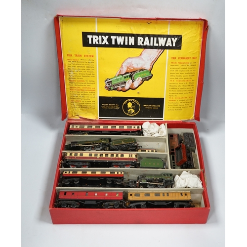 287 - A Trix Twin Railway 00 gauge train set box containing; four locomotives, eight bogie coaches, two ra... 