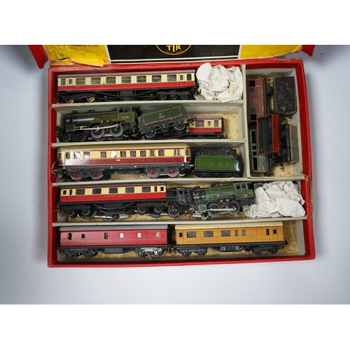 287 - A Trix Twin Railway 00 gauge train set box containing; four locomotives, eight bogie coaches, two ra... 