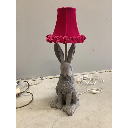 29 - A Contemporary adjustable floor lamp, a table lamp modelled as a hare and two others. Condition - fa... 