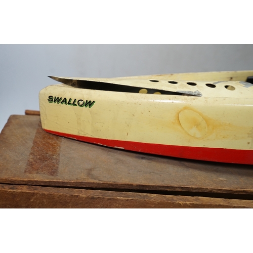 297 - A 1930s wooden boxed Bowman Models live steam speedboat; Swallow, of wood and tinplate constructio... 