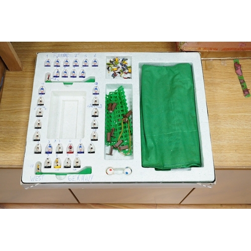 303 - Two boxed Subbuteo table football sets; a European Edition, comprising of two teams, spectators and ... 