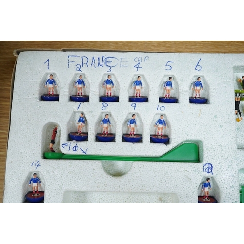 303 - Two boxed Subbuteo table football sets; a European Edition, comprising of two teams, spectators and ... 