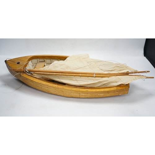 310 - A mid 20th century kit built wooden model sailing boat, Rob, of plank on frame construction with w... 