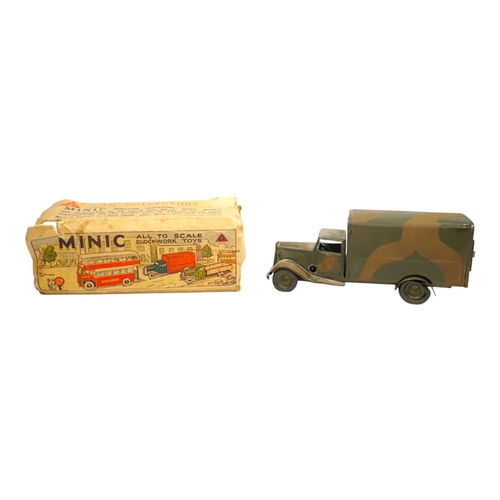 313 - A Tri-ang Minic clockwork tinplate army lorry, in camouflage paint work, together with the remains o... 