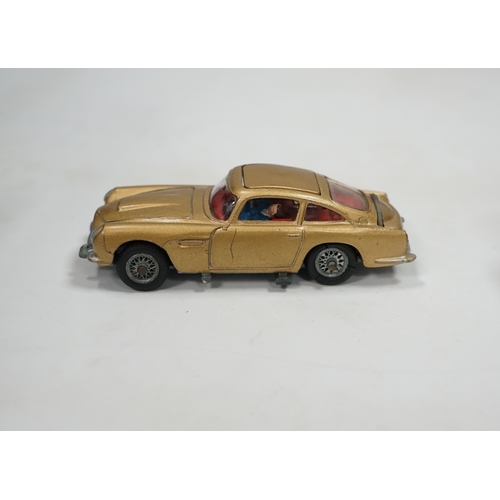 316 - A Corgi Toys (261) James Bond 007 Aston Martin in gold, together with its original box, card display... 