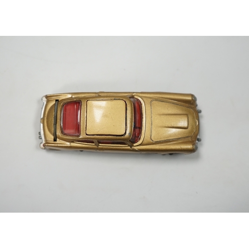 316 - A Corgi Toys (261) James Bond 007 Aston Martin in gold, together with its original box, card display... 