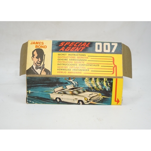 317 - A boxed Corgi Toys James Bond 007 Aston Martin DB5 (261), a gold Aston Martin, with inner display st... 