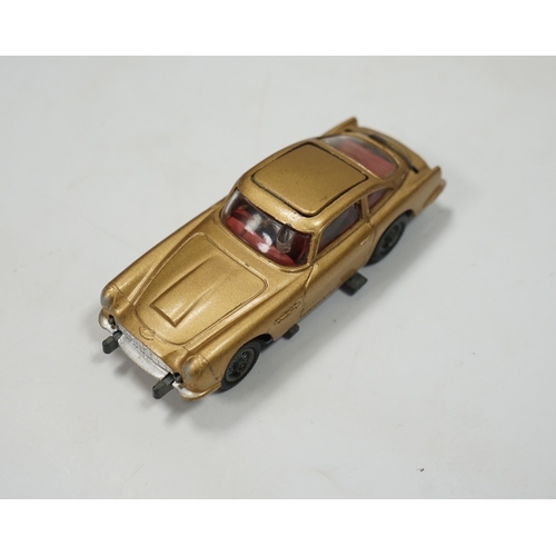 317 - A boxed Corgi Toys James Bond 007 Aston Martin DB5 (261), a gold Aston Martin, with inner display st... 