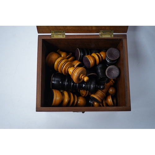 319 - A turned wooden chess set in ebony and boxwood, king 10.5cm high, in a hardwood box. Condition - goo... 