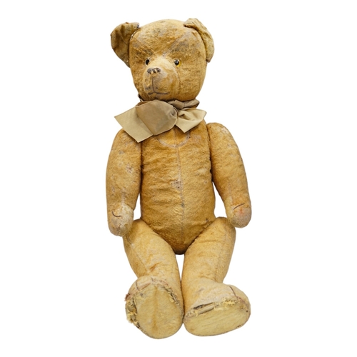 324 - A 1930s jointed Teddy bear, 53cm.  Condition - poor