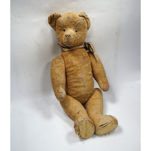 324 - A 1930s jointed Teddy bear, 53cm.  Condition - poor