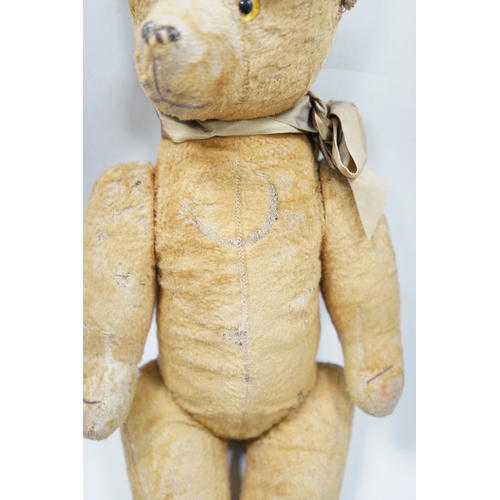 324 - A 1930s jointed Teddy bear, 53cm.  Condition - poor