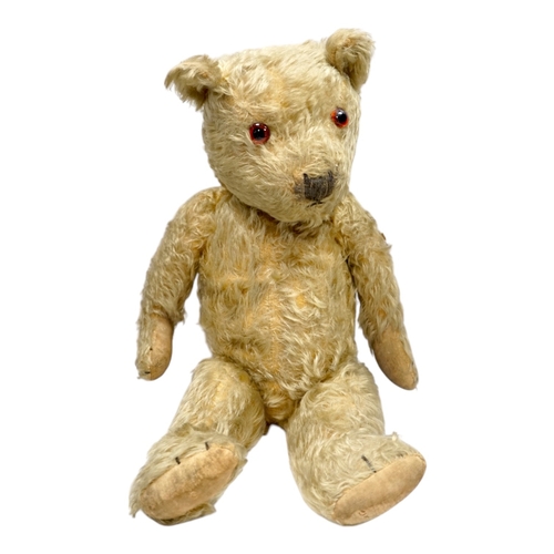 325 - A 1930s English Teddy bear, gold mohair plush and glass eyes, 49cm.  Condition - fair