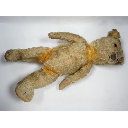 325 - A 1930s English Teddy bear, gold mohair plush and glass eyes, 49cm.  Condition - fair