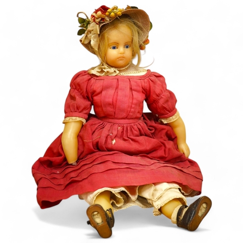 329 - A 19th century poured wax shoulder doll, paperweight eyes and jointed limbs, 60cm.  Condition - some... 