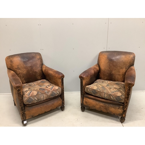 33 - A pair of early 20th century French leather club armchairs, width 73cm, depth 74cm, height 83cm. Con... 