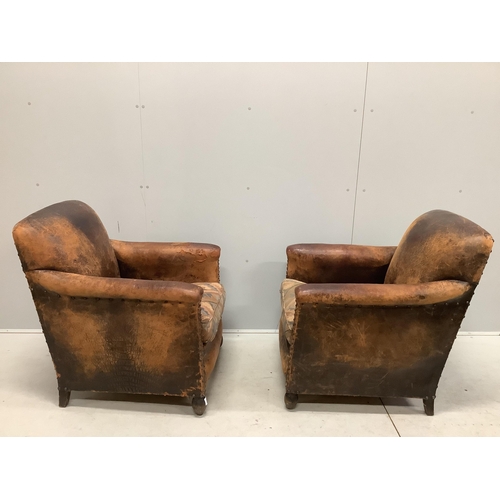 33 - A pair of early 20th century French leather club armchairs, width 73cm, depth 74cm, height 83cm. Con... 