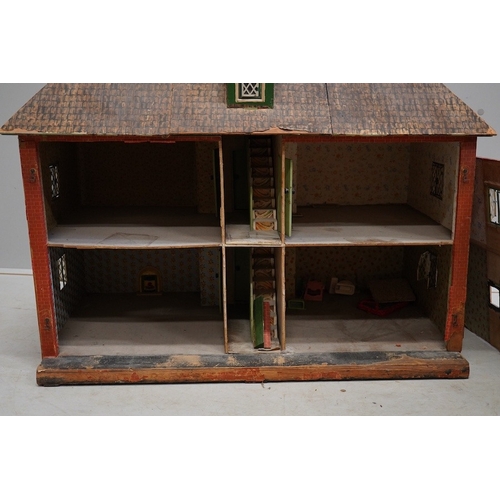 332 - A 1920s/30s commercially produced dolls house, possibly by Tri-ang, of plywood construction, overlai... 