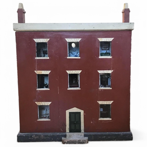 333 - A late 19th century doll's house, with a single front opening panel, incorporating eight internal ro... 