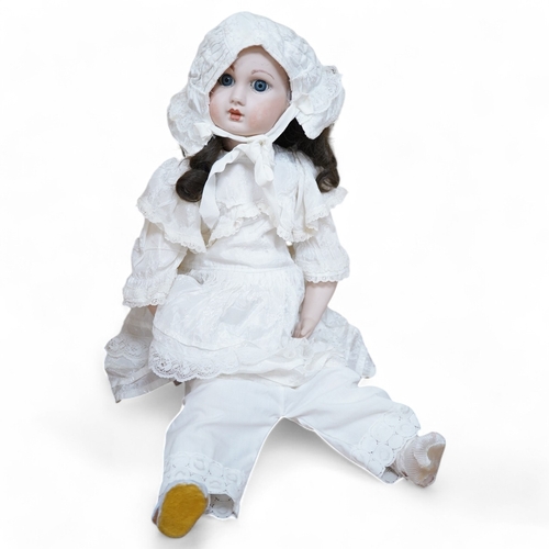 334 - A. Jules Steiner bisque doll, closed mouth and fixed glass eyes, cloth body with jointed bisque lowe... 