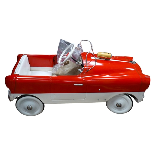 336 - A tinplate Tri-ang T65 pedal car, based on a Ford Zephyr, with vinyl padded seat, working steering, ... 