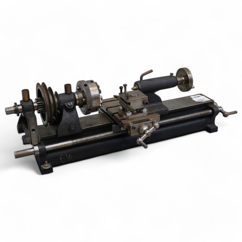 338 - A model engineering workshop lathe, by E.W. Stringer, length 60cm. Condition - fair, some surface ru... 